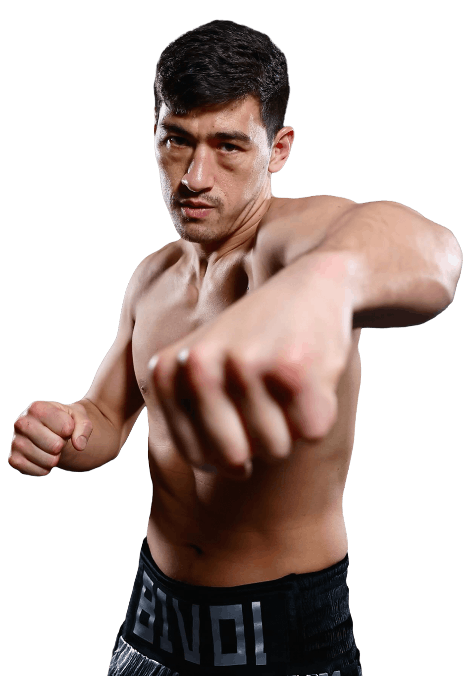 Dmitry Bivol standing in boxing pose for photoshoot